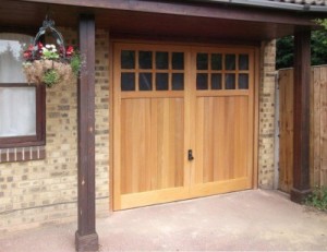 Woodrite Bierton cedar wood made to measure garage door with glazing